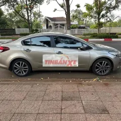 gd cần bán Kia Cerato 2016 STD Luxury Vàng cát