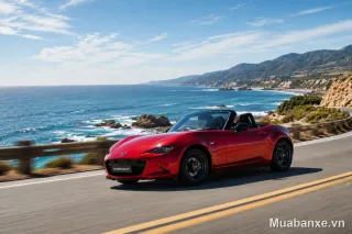Mazda Mx-5 màu đỏ 3/4 trước trên đường ven biển