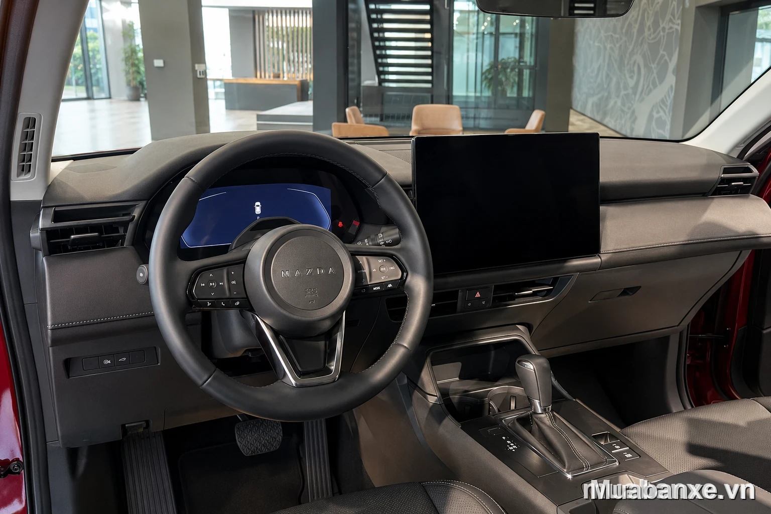 Nội thất Mazda CX-5 cao cấp với vô lăng hiện đại và màn hình giải trí lớn.
