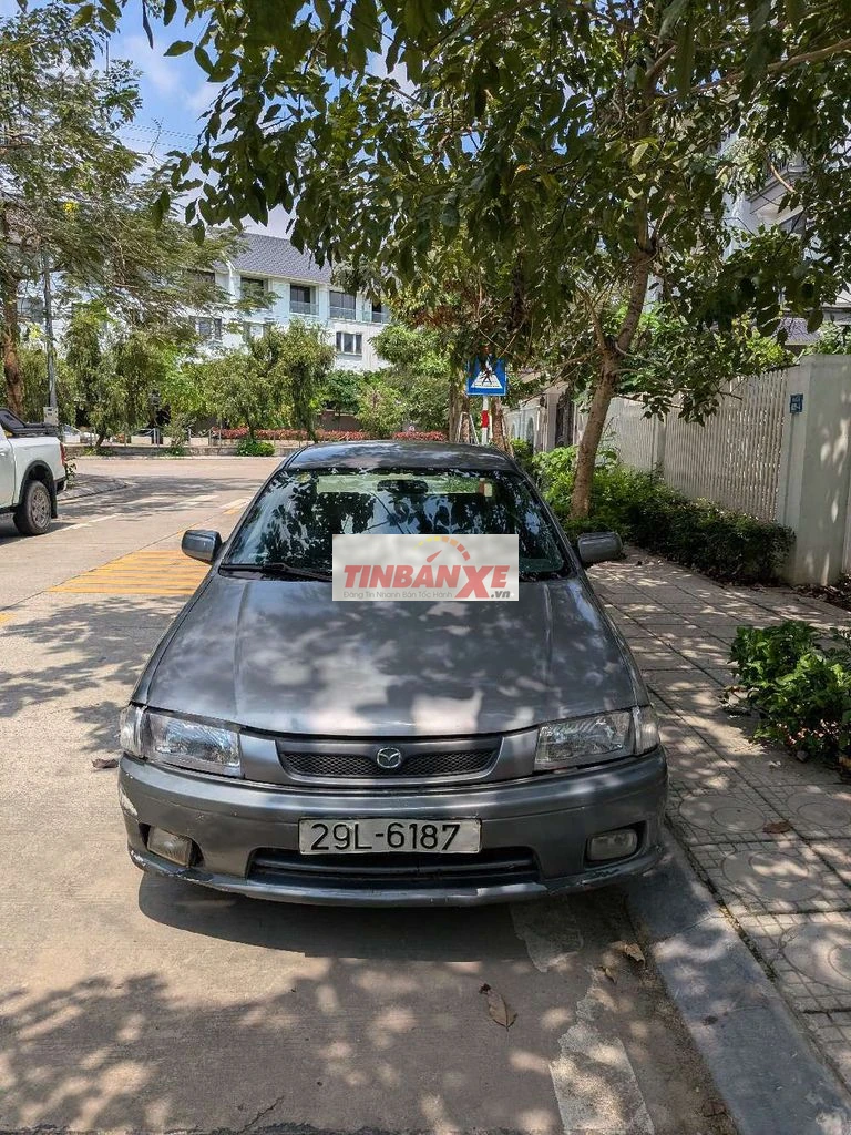 Mazda 323 màu Xám